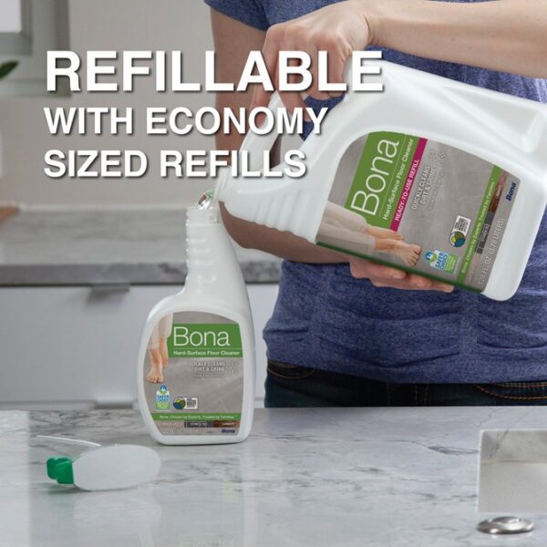 Bona hard surface floor cleaner refill being poured into spray bottle