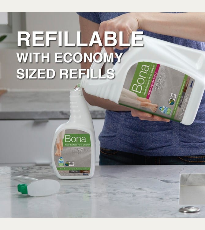 Bona hard surface floor cleaner refill being poured into spray bottle