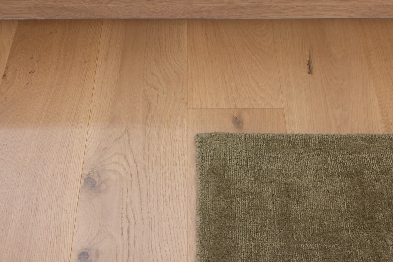 A close view of a timber floor surface showing the wood grain and finish.